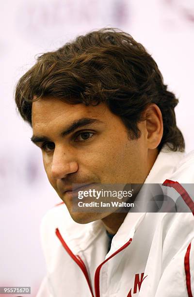 Roger Federer of Switzerland looks on during a press conference at the ATP Qatar Exxon Mobil Open at the Khalifa International Tennis and Squash...