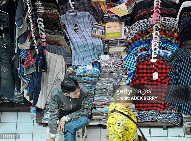 By Stephen Coates An Indonesian vendor waits for customers at his shop in Jakarta on December 30, 2009. China and Southeast Asia establish the...