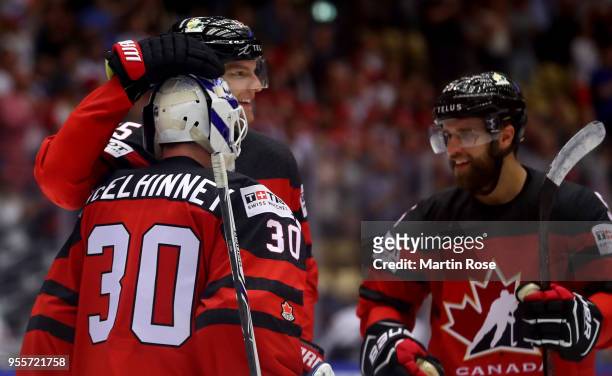 Curtis McElhinney, goaltender of Canada celebrate with team mate Colton Parayki after the 2018 IIHF Ice Hockey World Championship group stage game...