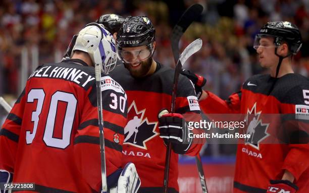 Curtis McElhinney, goaltender of Canada celebrate with team mate Aaron Ekblad after the 2018 IIHF Ice Hockey World Championship group stage game...