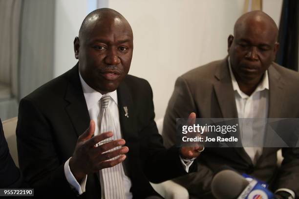 Derick Smith listens as lawyer Benjamin Crump speaks during a press conference about the announcement that his son's killer will not be charged on...