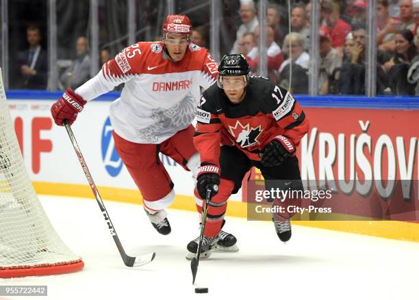 Oliver Lauridsen of Team Denmark and Jaden Schwartz of Team Canada during the IIHF World Championship game between Canada and Denmark at Jyske Bank...