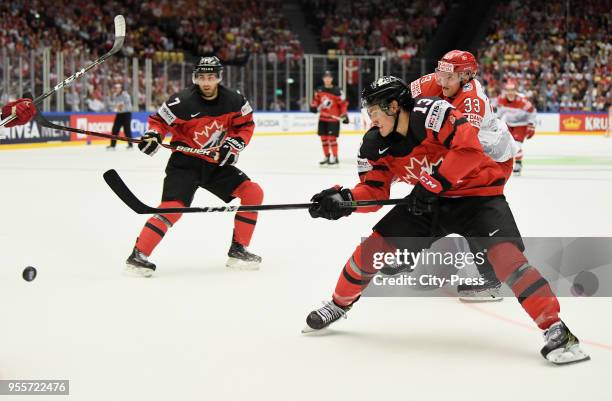 Jordan Eberle, Matt Barzal of Team Canada and Julian Jakobsen of Team Denmark during the IIHF World Championship game between Canada and Denmark at...