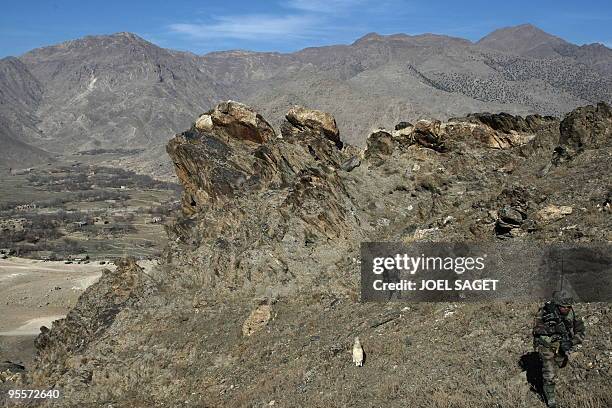 French soldiers of the Operational Mentoring and Liaison Teams of the Kandak 32 climb to the observation post, 'the eagle nest' in the Alah Say...