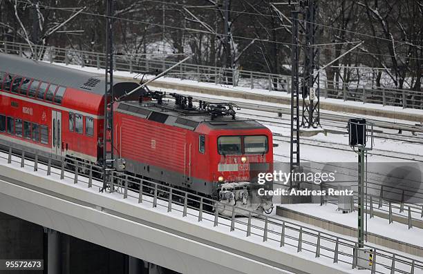 Deutsche Bahn train rides over a bridge on January 4, 2010 in Berlin, Germany. Subzero temperatures and snowfall are gripping Germany and are...