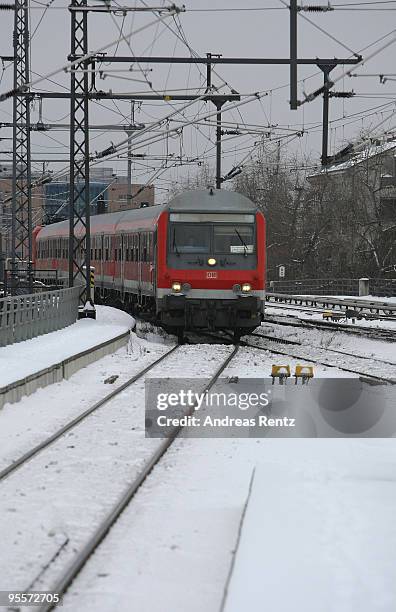 Deutsche Bahn train rides on a snow covered track on January 4, 2010 in Berlin, Germany. Subzero temperatures and snowfall are gripping Germany and...