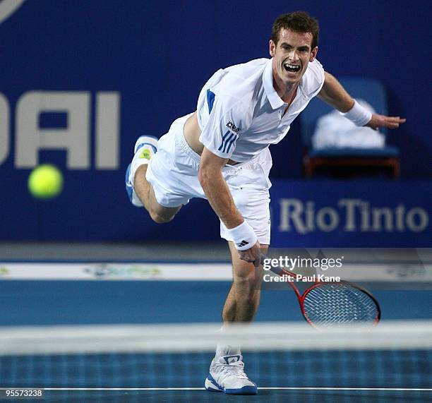 Andy Murray of Great Britain serves in his mixed doubles game, partnered by Laura Robson against Yaroslava Shvedova and Andrey Golubev of Kazakhstan...