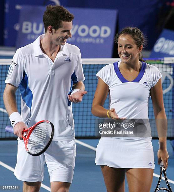 Andy Murray and Laura Robson of Great Britain talk tactics in their mixed doubles game against Yaroslava Shvedova and Andrey Golubev of Kazakhstan in...