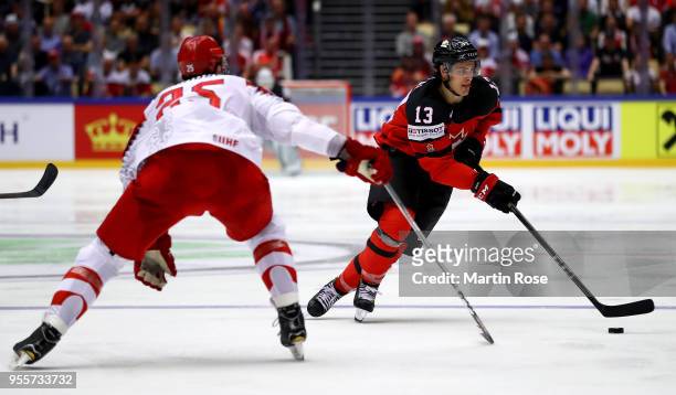 Matt Barzal of Canada and Oliver Lauridsen of Denmark battle for the puck during the 2018 IIHF Ice Hockey World Championship group stage game between...
