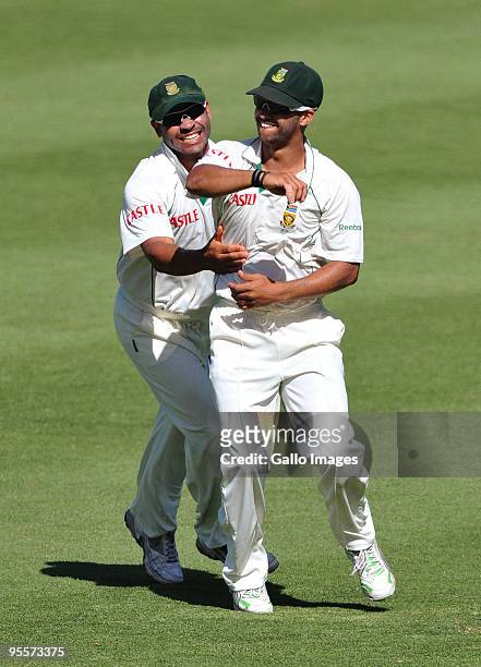 Ashwell Prince and JP Duminy of South Africa celebrate the wicket of Ian Bell of England for 48 runs during day 2 of the 3rd test match between South...
