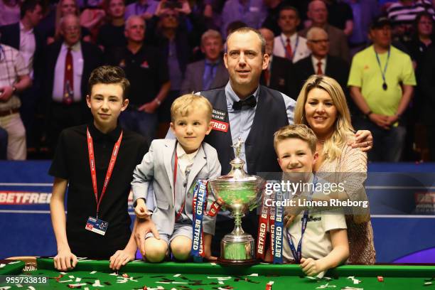Mark Williams of Wales pose for a picture with his family and with his trophy after winning the tournament during day seventeen of World Snooker...