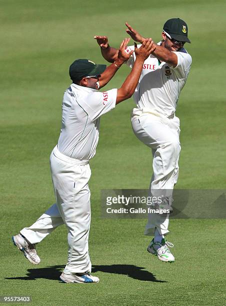 Ashwell Prince and JP Duminy of South Africa celebrate the wicket of Ian Bell of England for 48 runs during day 2 of the 3rd test match between South...