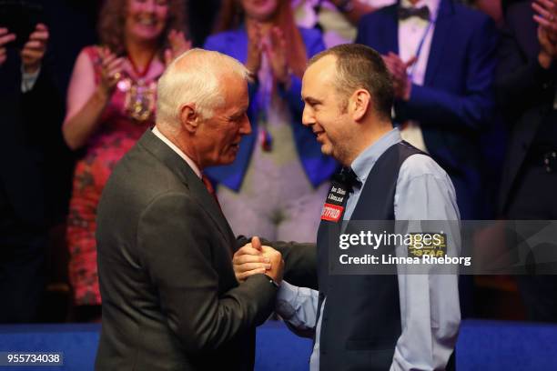 Barry Hearn, Chairman of World Snooker congratulates Mark Williams of Wales after he won the tournament during day seventeen of World Snooker...