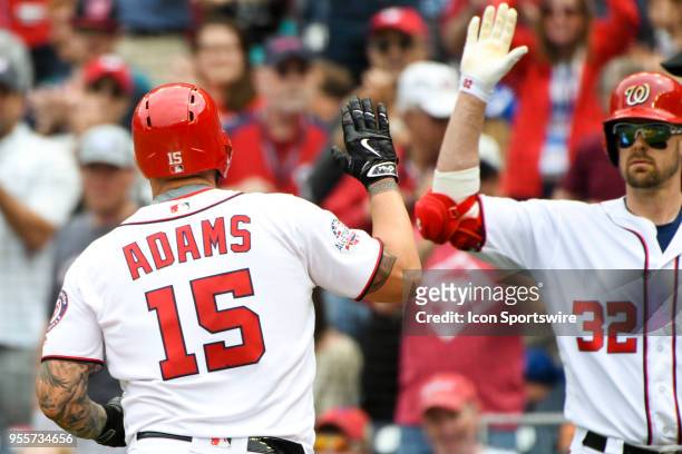 Washington Nationals first baseman Matt Adams is congratulated by catcher Matt Wieters after hitting a solo home run in the second inning during the...