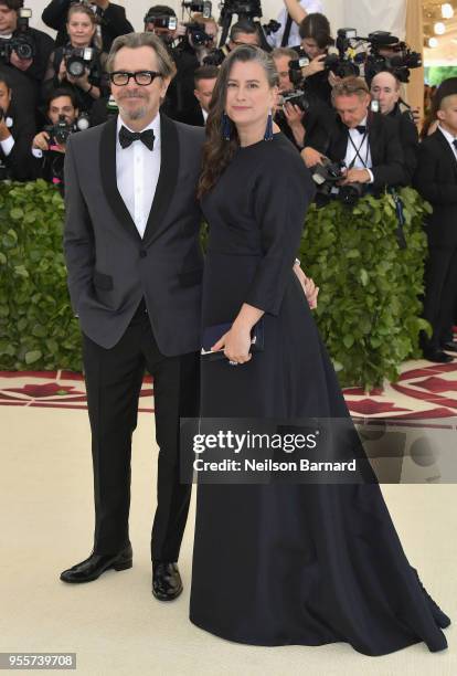 Gary Oldman and Gisele Schmidt attend the Heavenly Bodies: Fashion & The Catholic Imagination Costume Institute Gala at The Metropolitan Museum of...