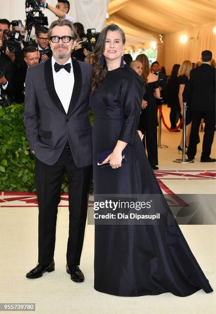 Gary Oldman and Gisele Schmidt attend the Heavenly Bodies: Fashion & The Catholic Imagination Costume Institute Gala at The Metropolitan Museum of...