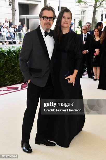 Actor Gary Oldman and his wife Gisele Schmidt attend the Heavenly Bodies: Fashion & The Catholic Imagination Costume Institute Gala at The...