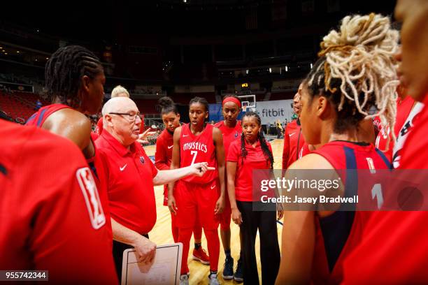 Head Coach Mike Thibault of the Washington Mystics huddle with the team after a pre-season game against the Minnesota Lynx on May 6, 2018 at the...
