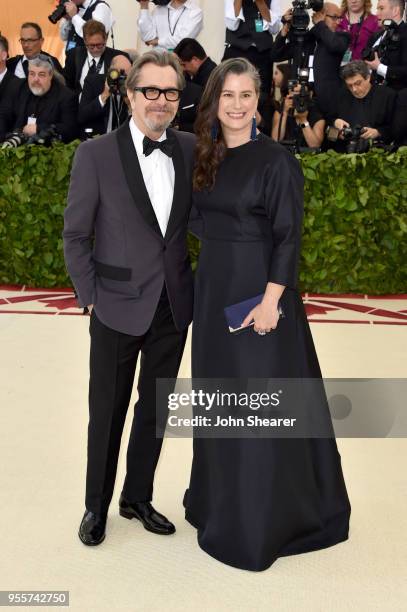 Gary Oldman and Gisele Schmidt attend the Heavenly Bodies: Fashion & The Catholic Imagination Costume Institute Gala at The Metropolitan Museum of...
