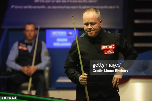 John Higgins of Scotland reacts during the fourth session of the final against Mark Williams of Wales during day sixteen of World Snooker...