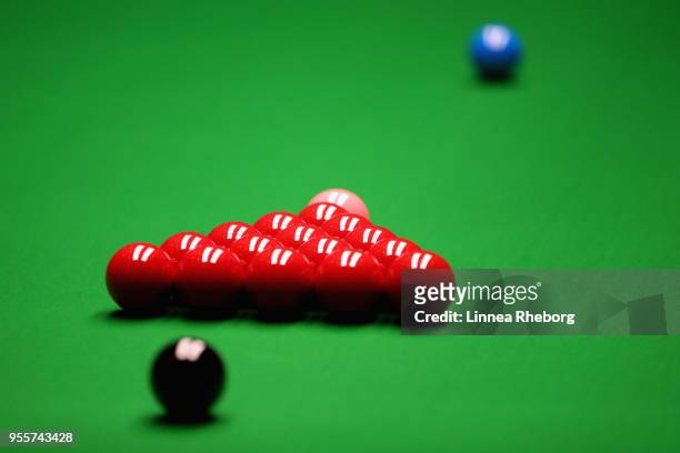 View of the snooker balls placed on the snooker table ahead of the fourth session of the final between John Higgins of Scotland and Mark Williams of...