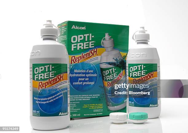 Bottles of Opti-Free Replenish contact lens cleaning fluid, produced by Alcon Inc., are arranged for a photograph in Paris, France, on Monday, Jan....