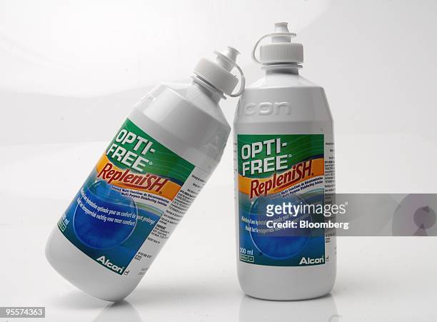 Bottles of Opti-Free Replenish contact lens cleaning fluid, produced by Alcon Inc., are arranged for a photograph in Paris, France, on Monday, Jan....