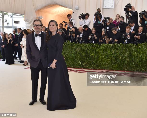 Gary Oldman and Gisele Schmidt arrives for the 2018 Met Gala on May 7 at the Metropolitan Museum of Art in New York. - The Gala raises money for the...