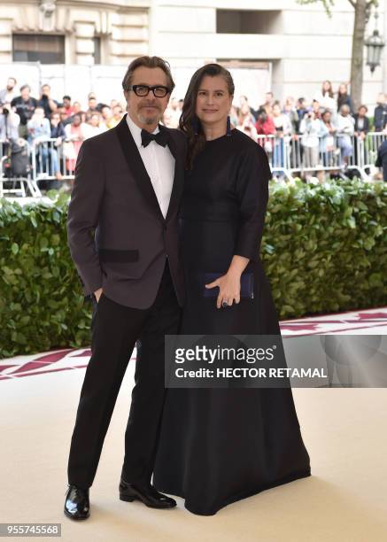 Gary Oldman and Gisele Schmidt arrives for the 2018 Met Gala on May 7 at the Metropolitan Museum of Art in New York. - The Gala raises money for the...
