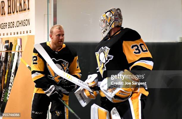 Patric Hornqvist of the Pittsburgh Penguins and Matt Murray of the Pittsburgh Penguins prepare to take the ice against the Washington Capitals in...