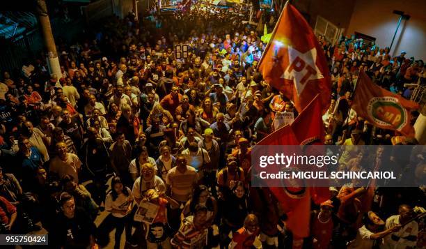 People take part in a rally against the imprisonment of Brazilian former president Luiz Inacio Lula da Silva outside the Metal Workers' Union...