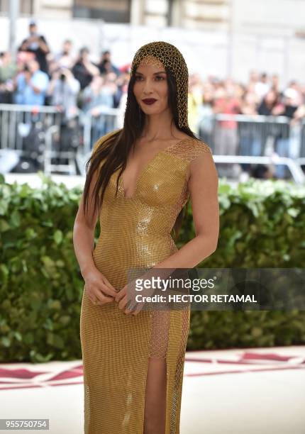 Actress Olivia Munn arrives for the 2018 Met Gala on May 7 at the Metropolitan Museum of Art in New York. - The Gala raises money for the...