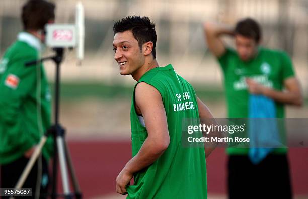 Mesut Oezil of Bremen smiles during the Werder Bremen training session at the Al Wasl training ground on January 4, 2010 in Dubai, United Arab...