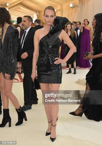 Amber Valletta attends the Heavenly Bodies: Fashion & The Catholic Imagination Costume Institute Gala at The Metropolitan Museum of Art on May 7,...