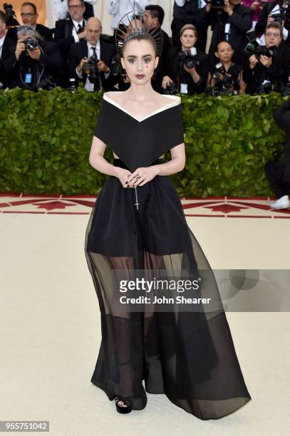 Lily Collins attends the Heavenly Bodies: Fashion & The Catholic Imagination Costume Institute Gala at The Metropolitan Museum of Art on May 7, 2018...
