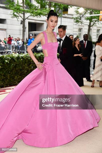 Ming Xi attends the Heavenly Bodies: Fashion & The Catholic Imagination Costume Institute Gala at The Metropolitan Museum of Art on May 7, 2018 in...