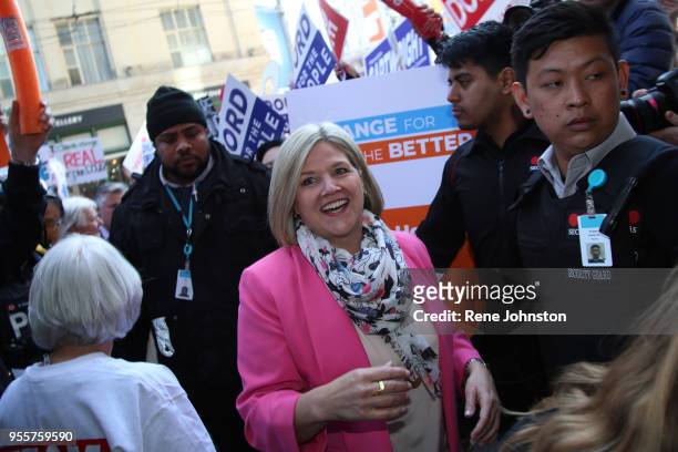 Toronto-Debate Supporters. NDP Leader Andrea Horwath arrives at the debates while supporters of all parties wait for their leaders in front of City...