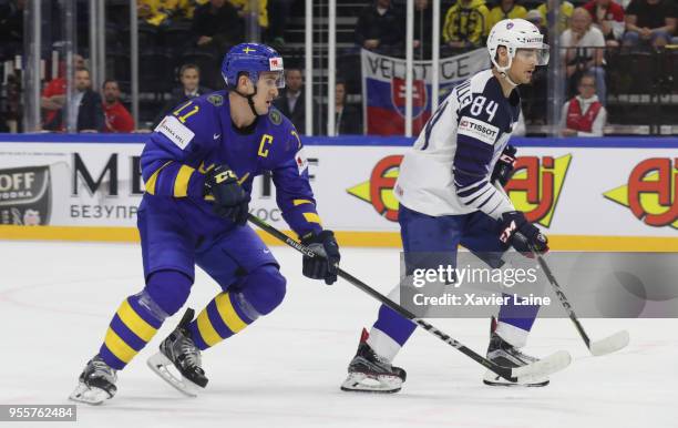 Captain Mikael Backlund of Sweden score a goal over Kevin Hecquefeuille of France is disapointed during the 2018 IIHF Ice Hockey World Championship...