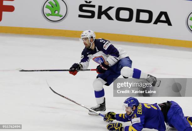 Damien Fleury of France in action with Olivier Ekman-Larsson of Sweden during the 2018 IIHF Ice Hockey World Championship Group A between Sweden and...