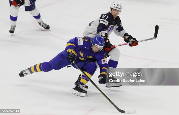 Anthony Rech of France in action with Johan Larsson of Sweden during the 2018 IIHF Ice Hockey World Championship Group A between Sweden and France at...