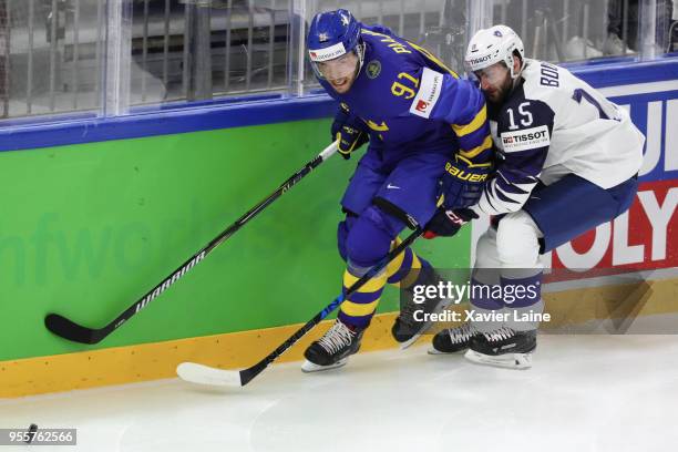 Magnus Paajarvi of Sweden in action with Maurin Bouvet of France during the 2018 IIHF Ice Hockey World Championship Group A between Sweden and France...