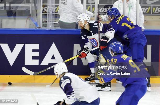 Stephane Da Costa of France in action with Mattias Janmark of Sweden during the 2018 IIHF Ice Hockey World Championship Group A between Sweden and...