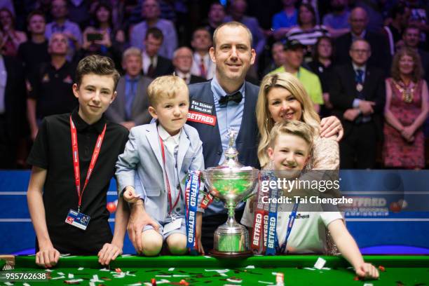 Mark Williams of Wales and his families pose for a picture with his trophy after winning the final match against John Higgins of Scotland on day...