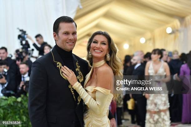 Tom Brady and Gisele Bundchen arrive for the 2018 Met Gala on May 7 at the Metropolitan Museum of Art in New York. / The erroneous mention[s]...
