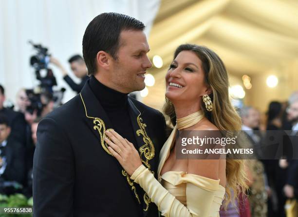 Tom Brady and Gisele Bundchen arrive for the 2018 Met Gala on May 7 at the Metropolitan Museum of Art in New York. / The erroneous mention[s]...