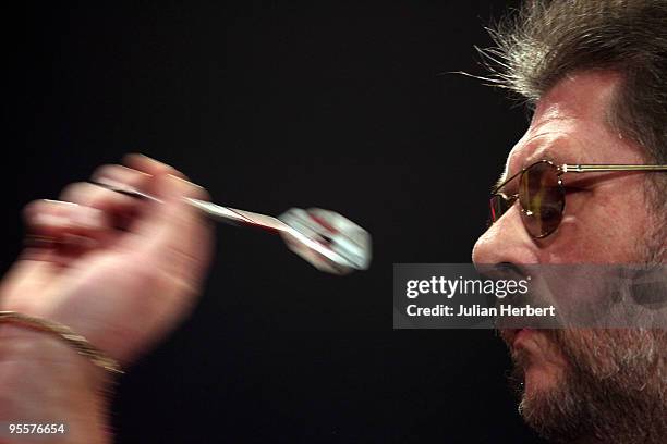 Martin Adams of England in action against Anthony Fleet of Australia during the First Round Match of World Professional Darts Championship at The...