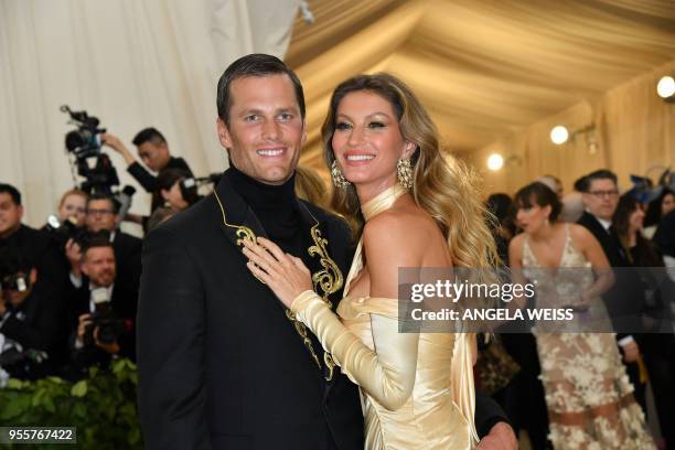 Tom Brady and Gisele Bundchen arrive for the 2018 Met Gala on May 7 at the Metropolitan Museum of Art in New York. / The erroneous mention[s]...