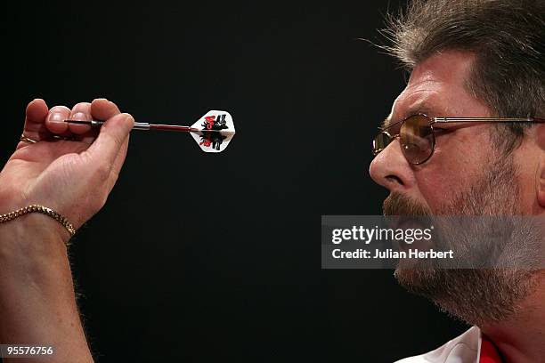 Martin Adams of England in action against Anthony Fleet of Australia during the First Round Match of World Professional Darts Championship at The...