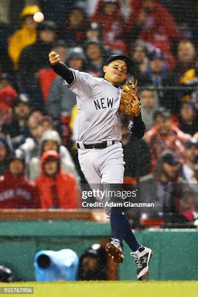 Ronald Torreyes of the New York Yankees makes a throw to first base in the fourth inning of a game against the Boston Red Sox at Fenway Park on April...