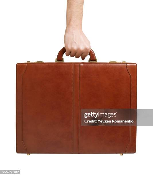 brown leather briefcase in hand - mallette photos et images de collection